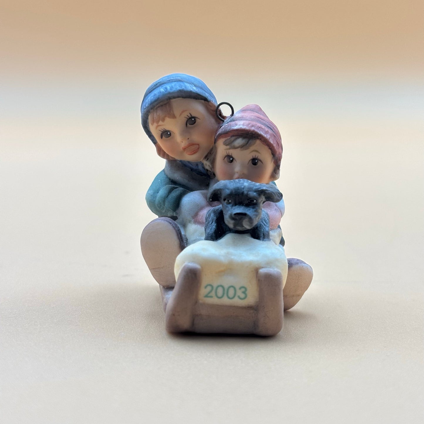 Goebel 2003 Boy and Girl on Sled Ornament with Puppy