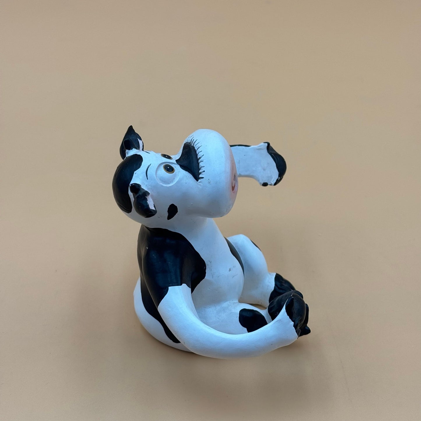 Stretch-Arm Cow Figurine – L Dake & Ln Vintage Stone Like