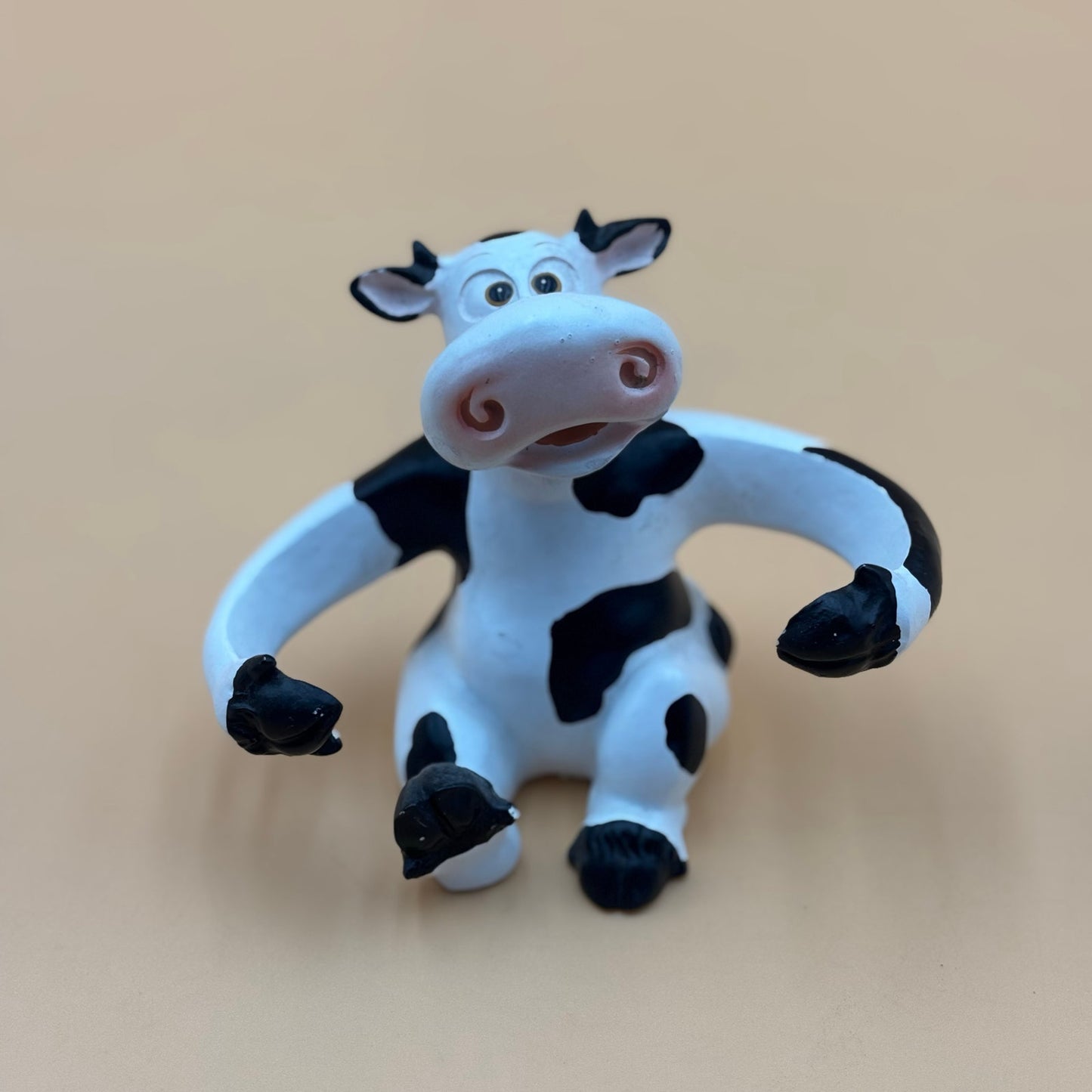Stretch-Arm Cow Figurine – L Dake & Ln Vintage Stone Like