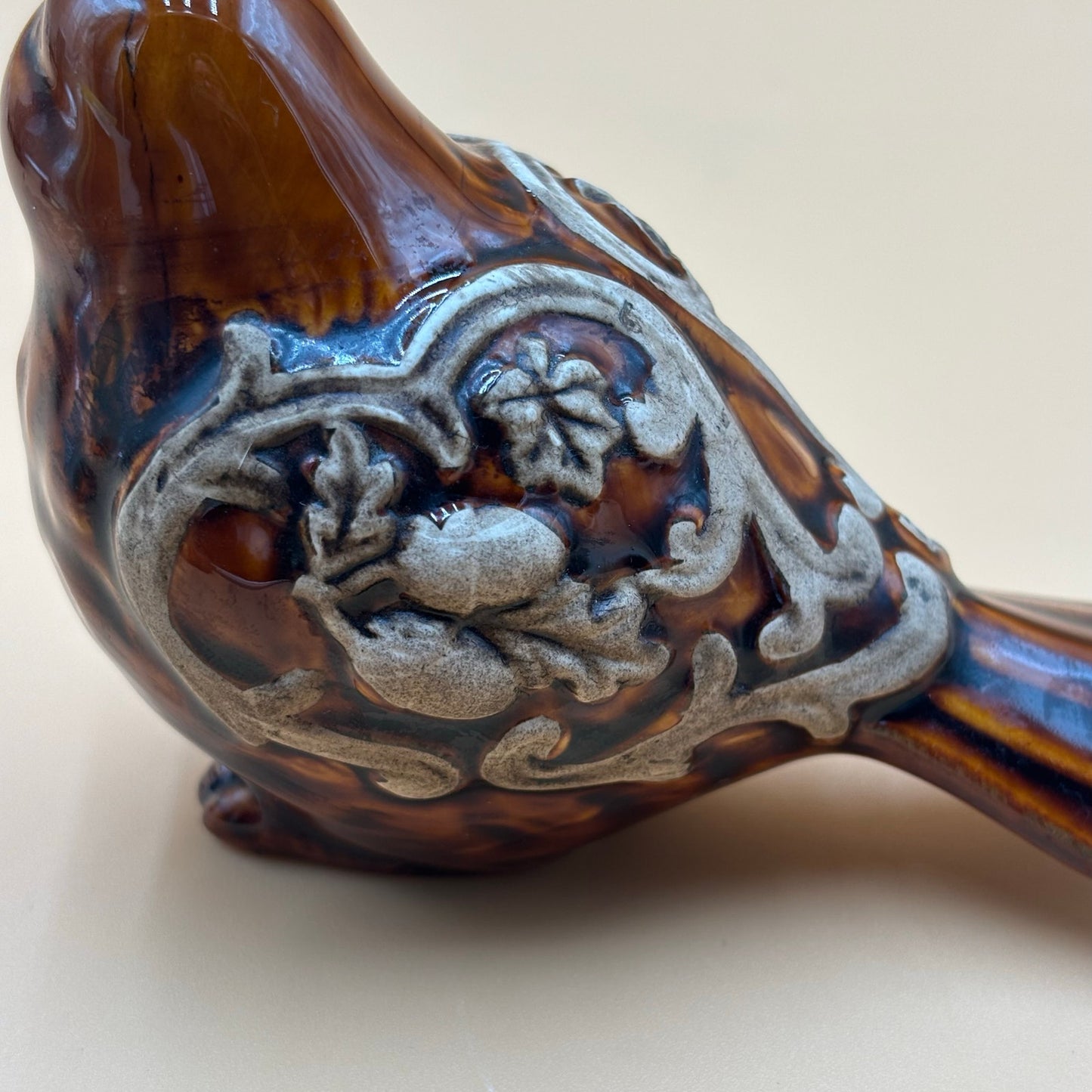Brown Glazed Ceramic Bird Figurine with Raised Leaf and Vine Detail