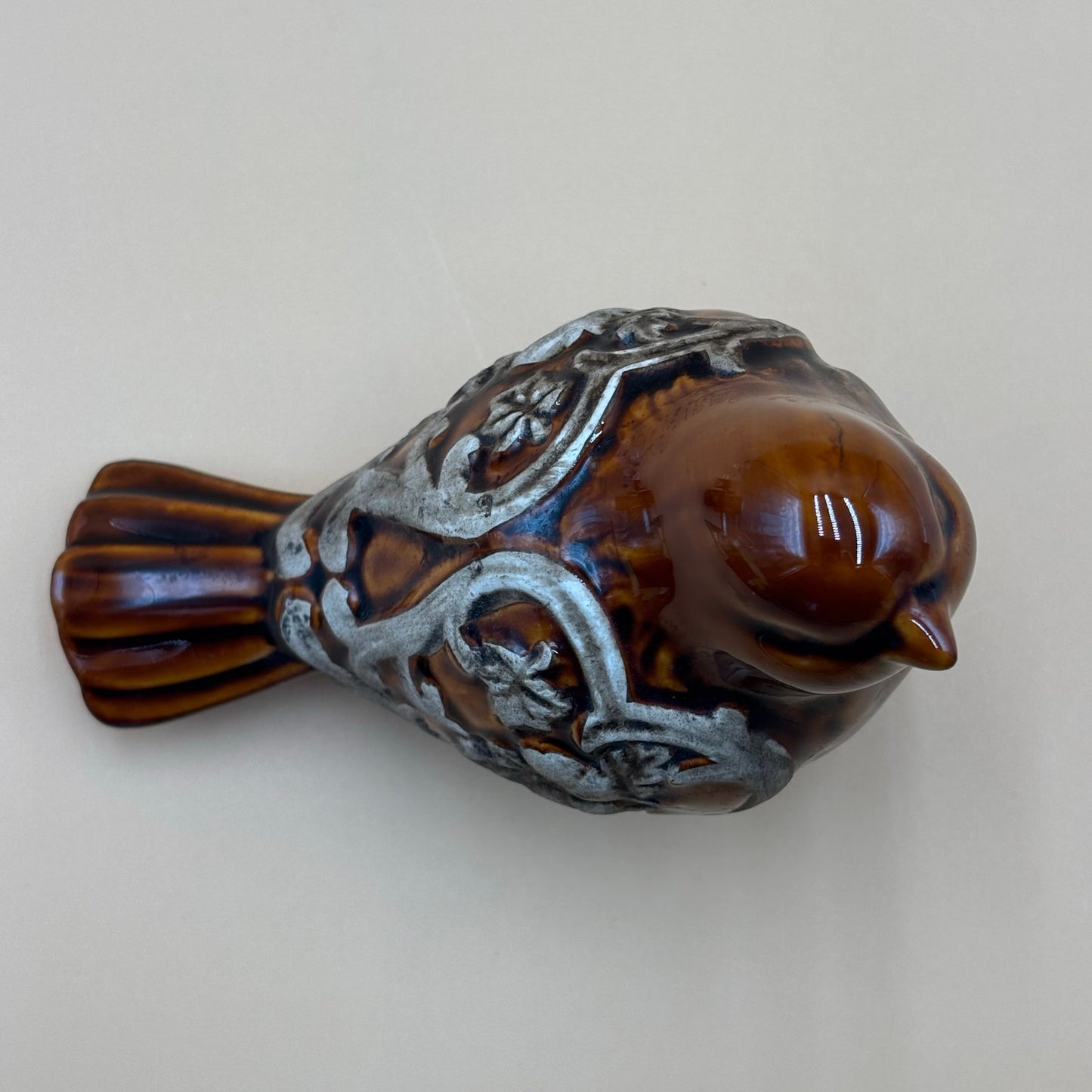 Brown Glazed Ceramic Bird Figurine with Raised Leaf and Vine Detail