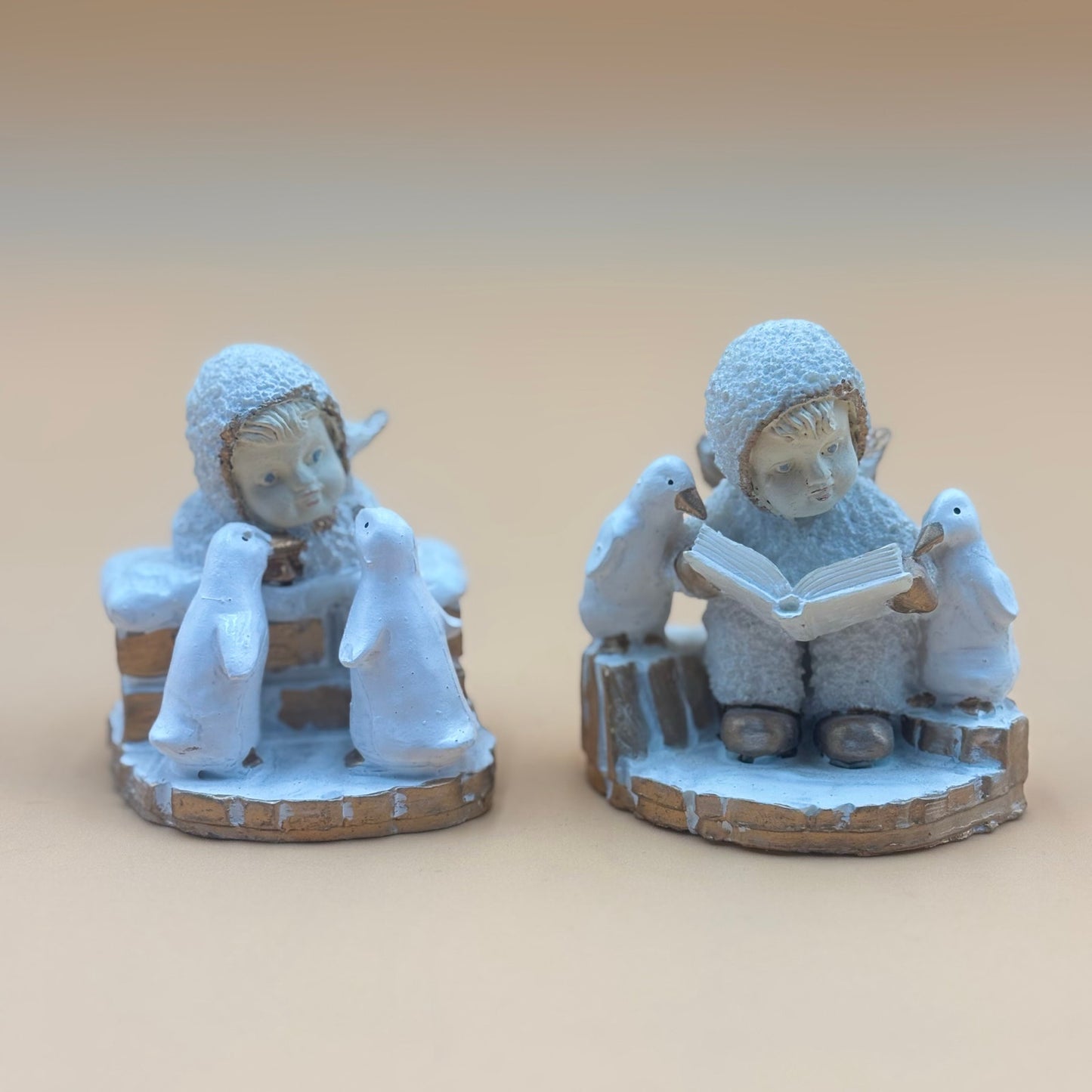Textured Vintage resin 5 piece winter wonderland figurine with snow men and penguins