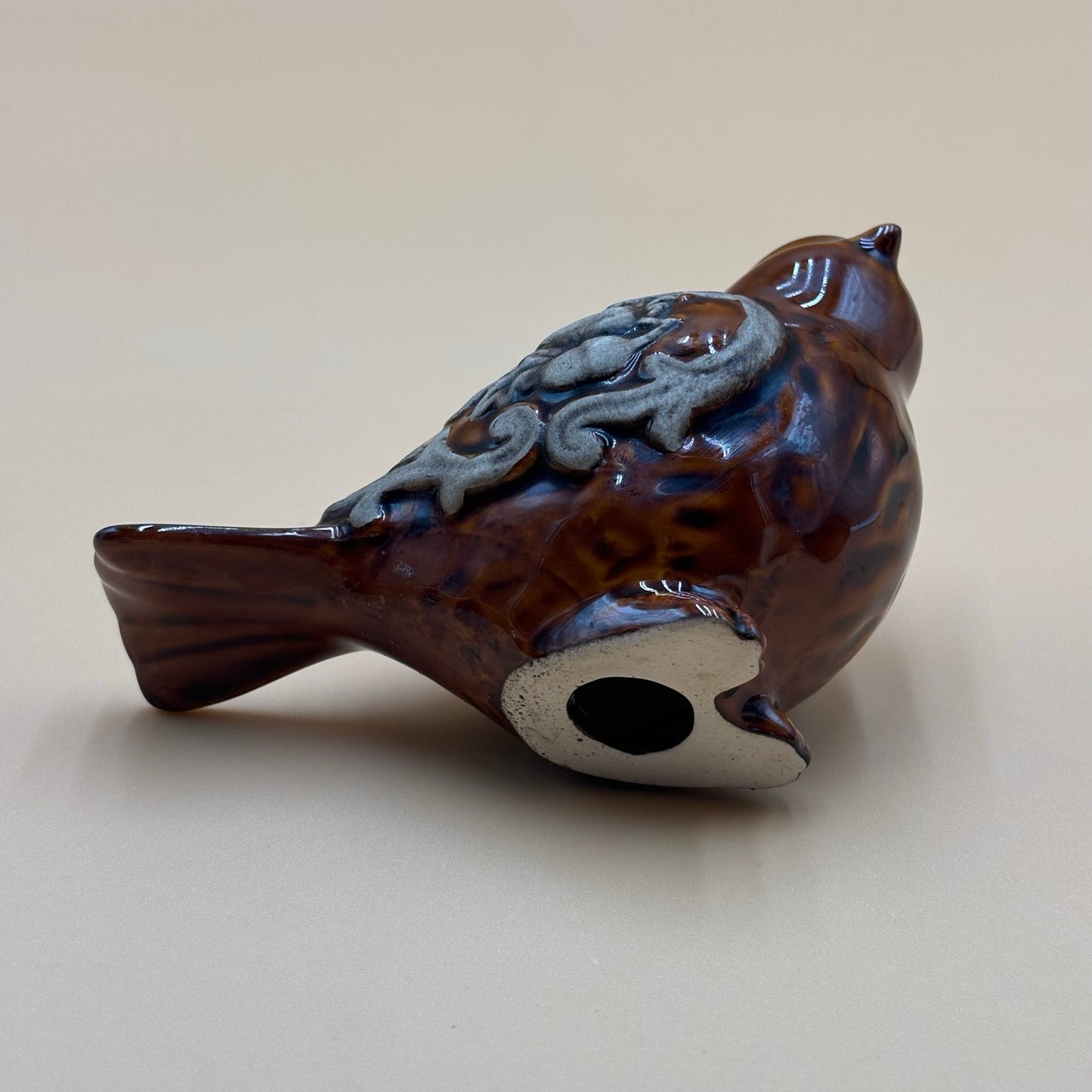 Brown Glazed Ceramic Bird Figurine with Raised Leaf and Vine Detail
