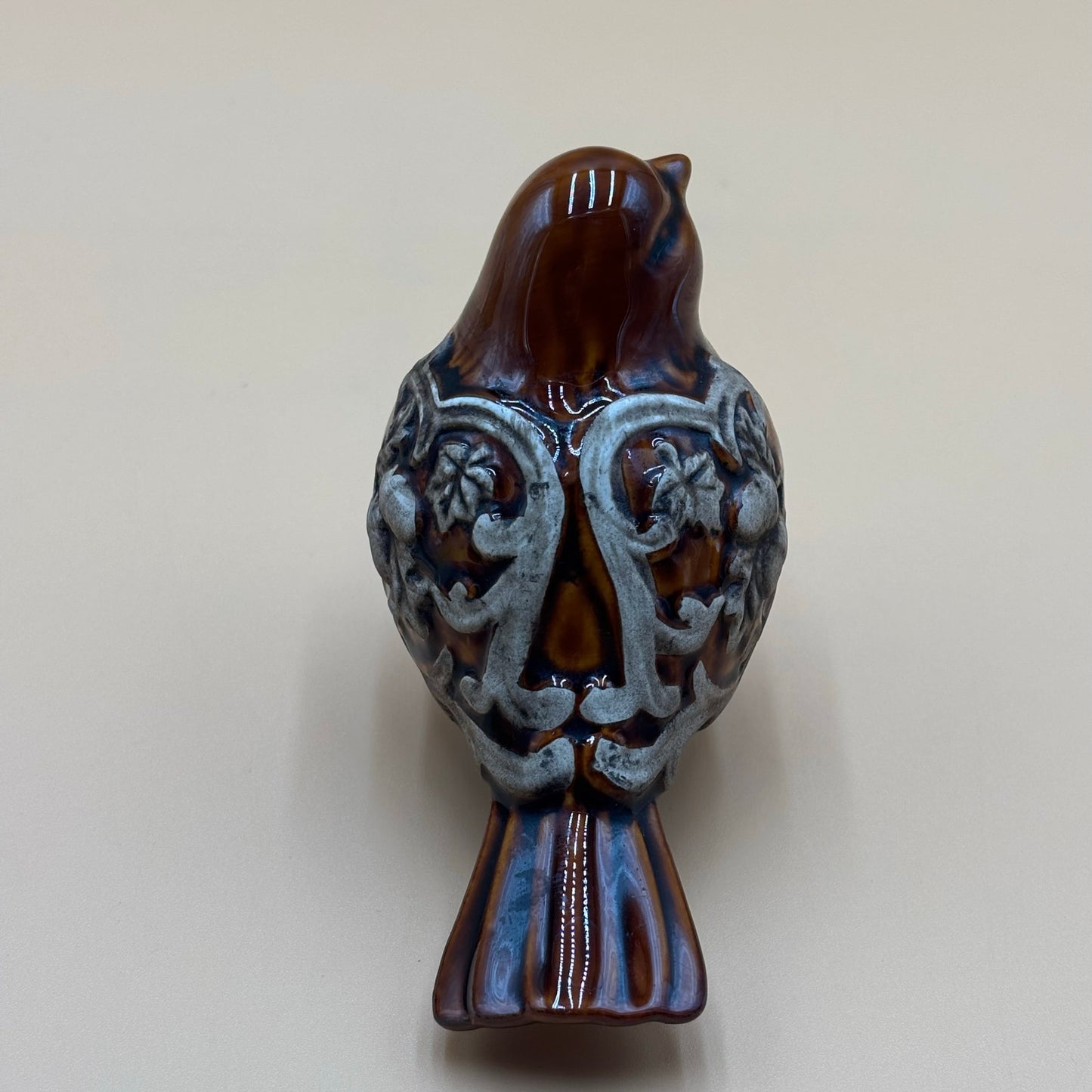 Brown Glazed Ceramic Bird Figurine with Raised Leaf and Vine Detail