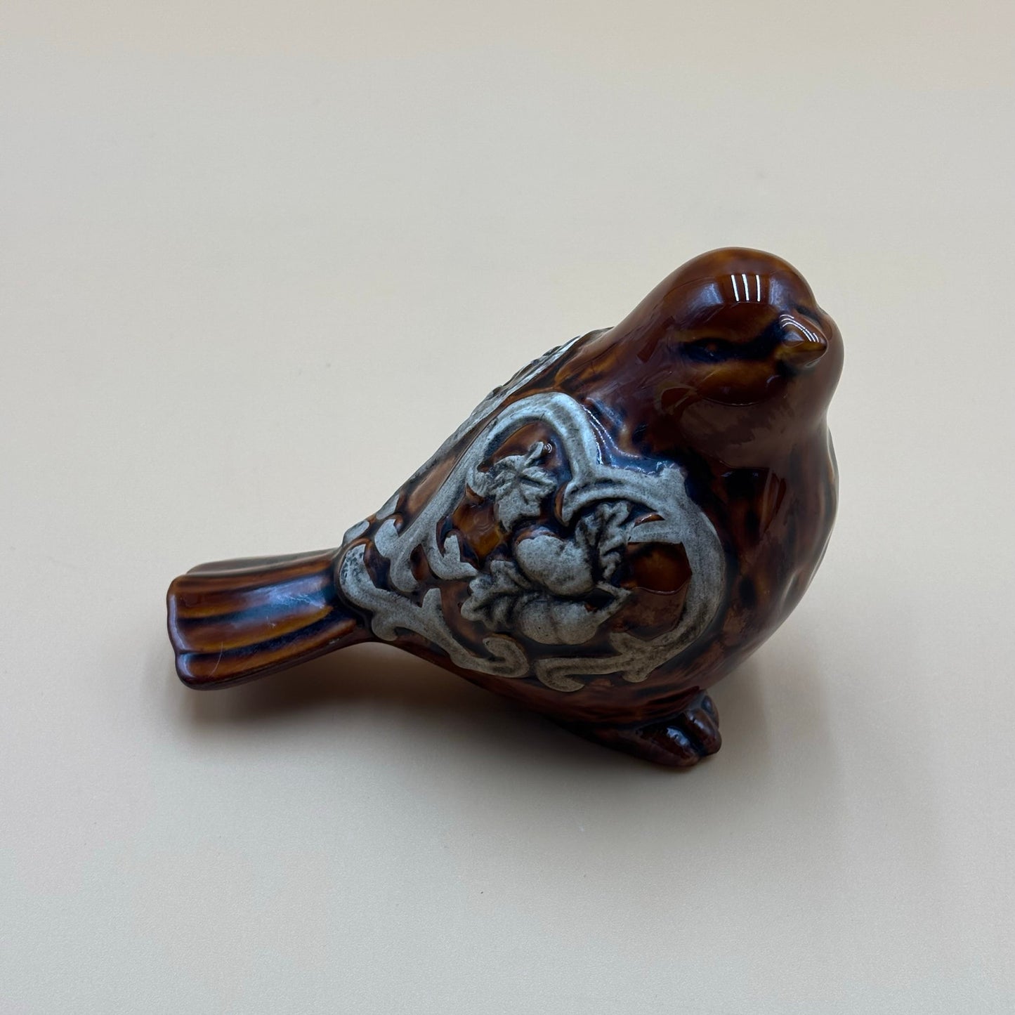 Brown Glazed Ceramic Bird Figurine with Raised Leaf and Vine Detail