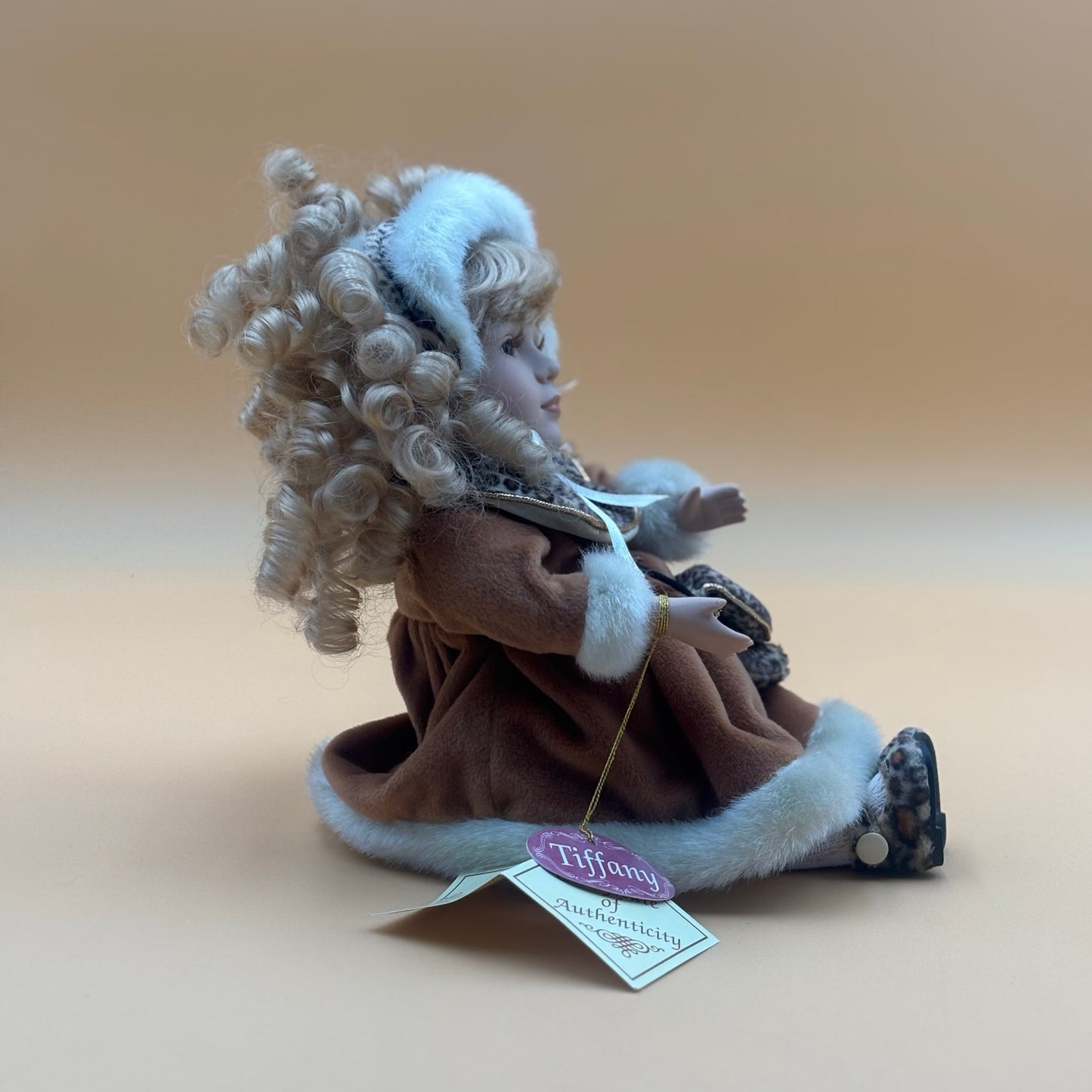 Collector’s Choice Animated Musical Porcelain Doll with Faux Fur & Leopard Trim Coat