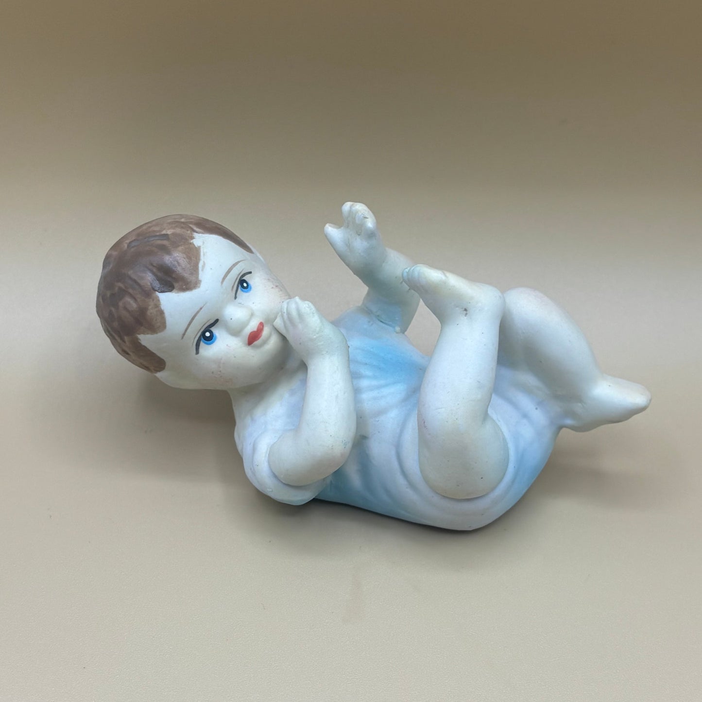 Pair of Porcelain Vintage Playing Baby Figurines