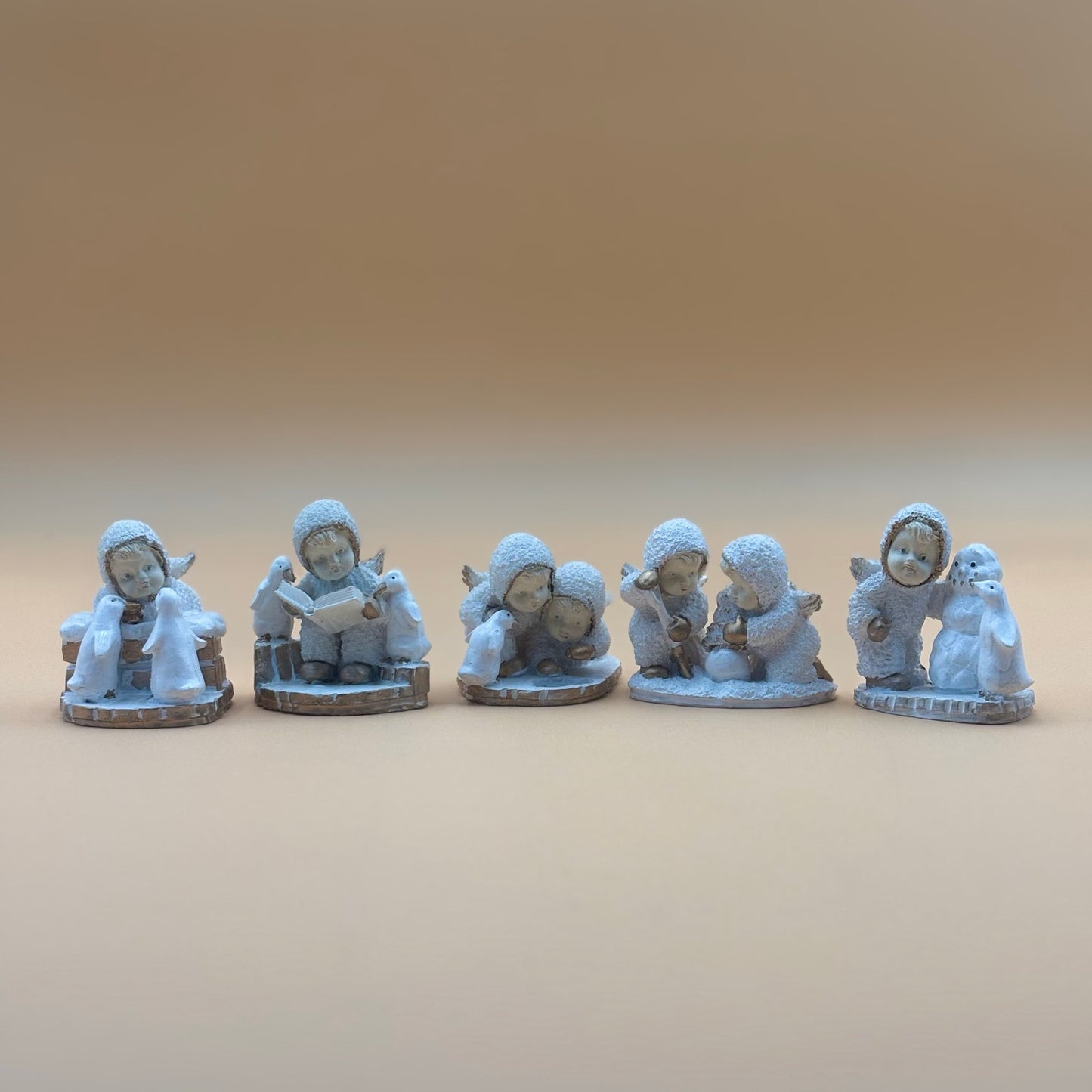 Textured Vintage resin 5 piece winter wonderland figurine with snow men and penguins
