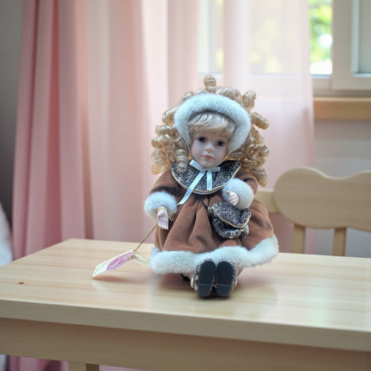 Collector’s Choice Animated Musical Porcelain Doll with Faux Fur & Leopard Trim Coat