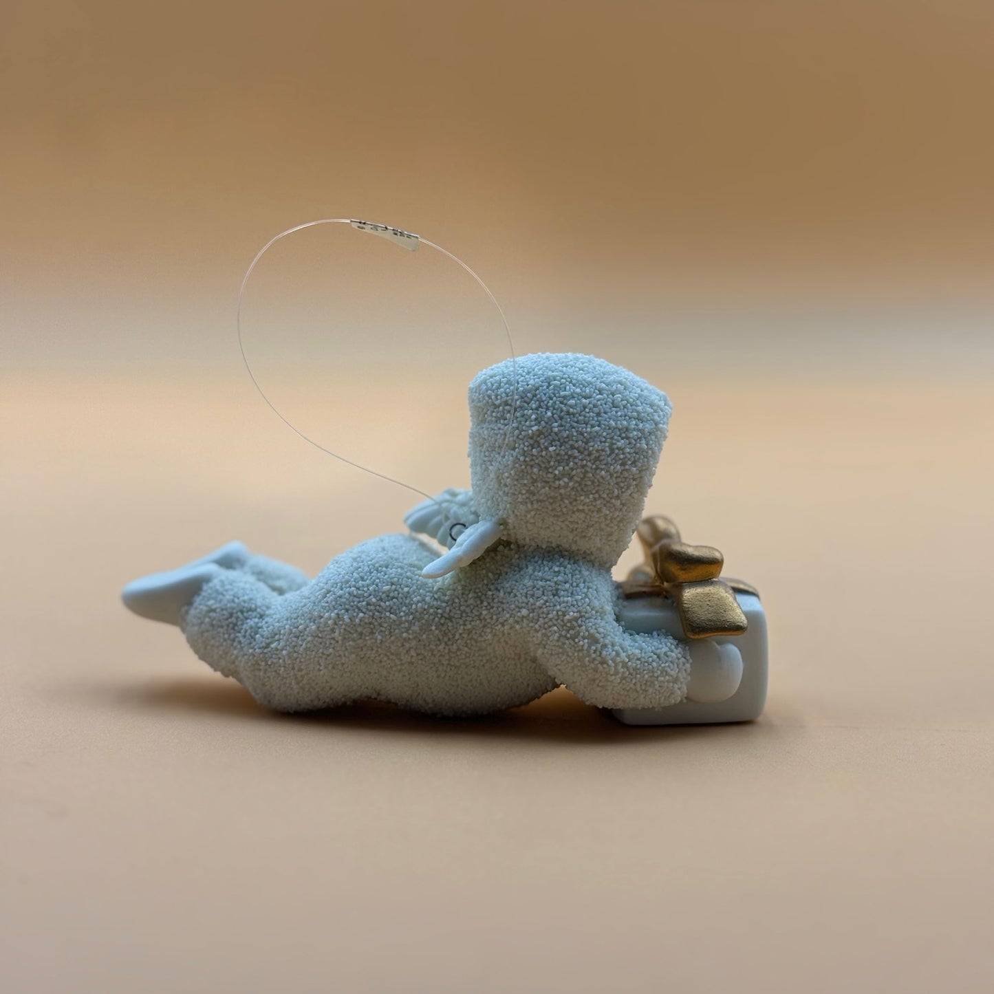 Department 56 Snowbabies “Gift Bearer” Ornament – Laying with Present