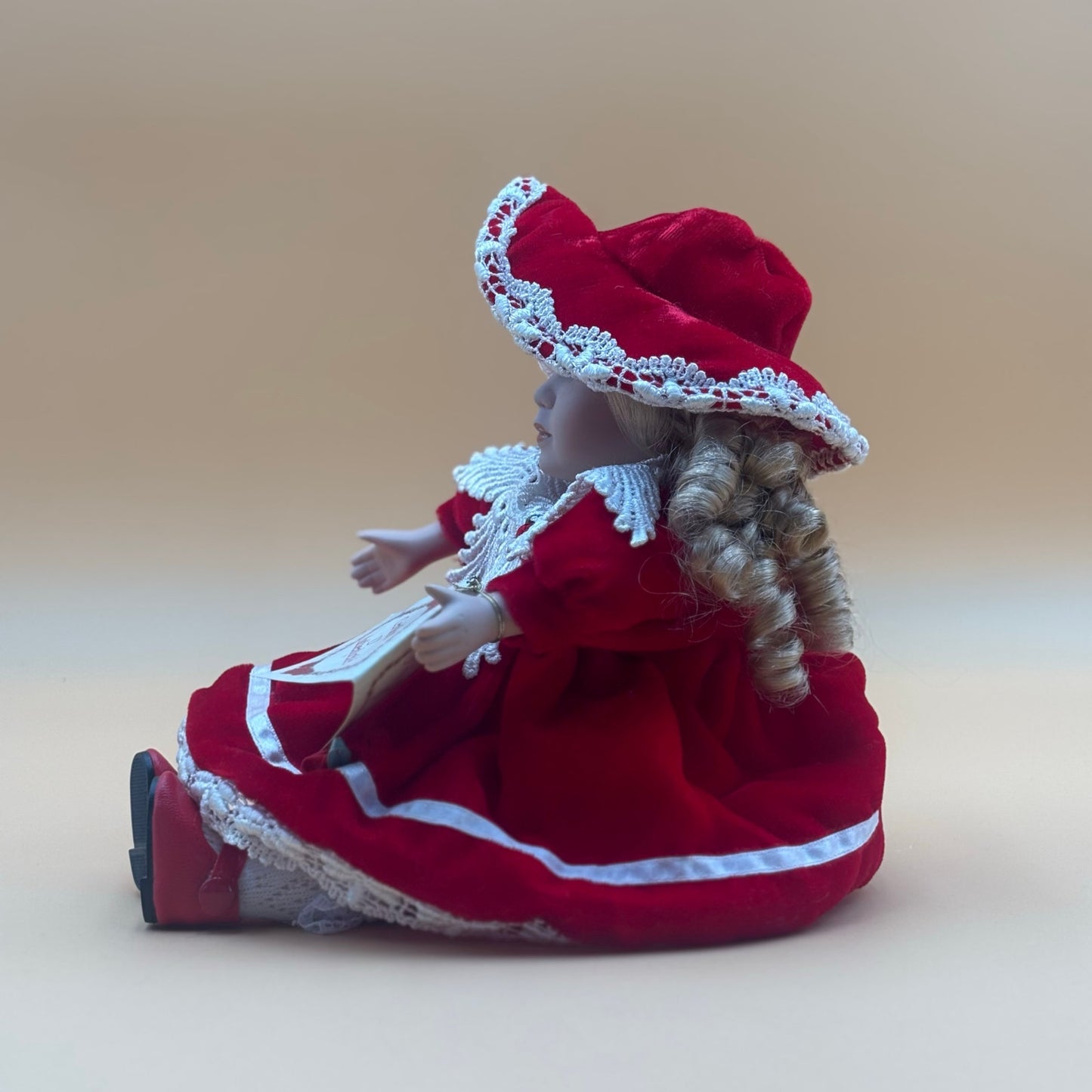 Collector’s Choice Musical Porcelain Doll in Red Velvet Dress with Bonnet