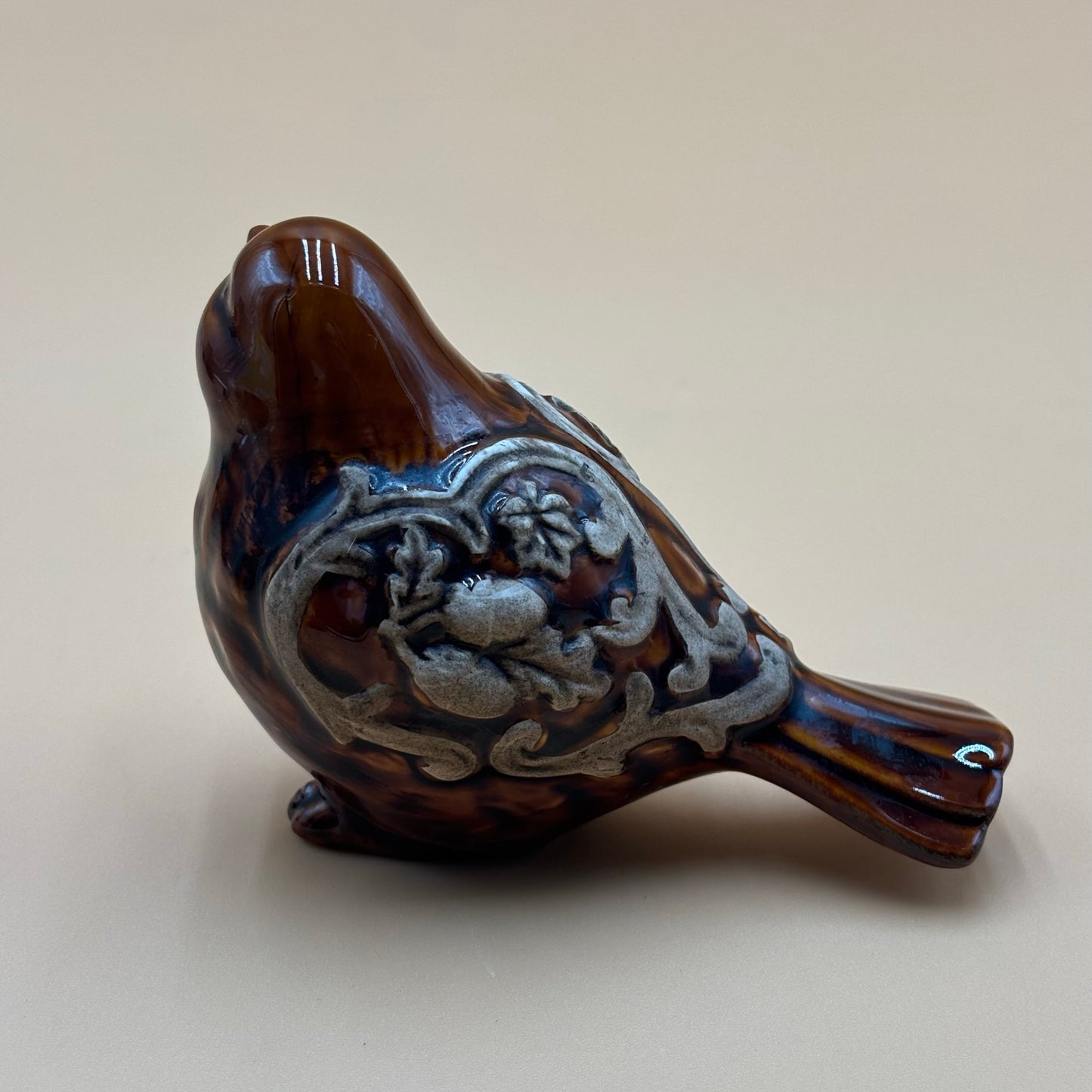 Brown Glazed Ceramic Bird Figurine with Raised Leaf and Vine Detail