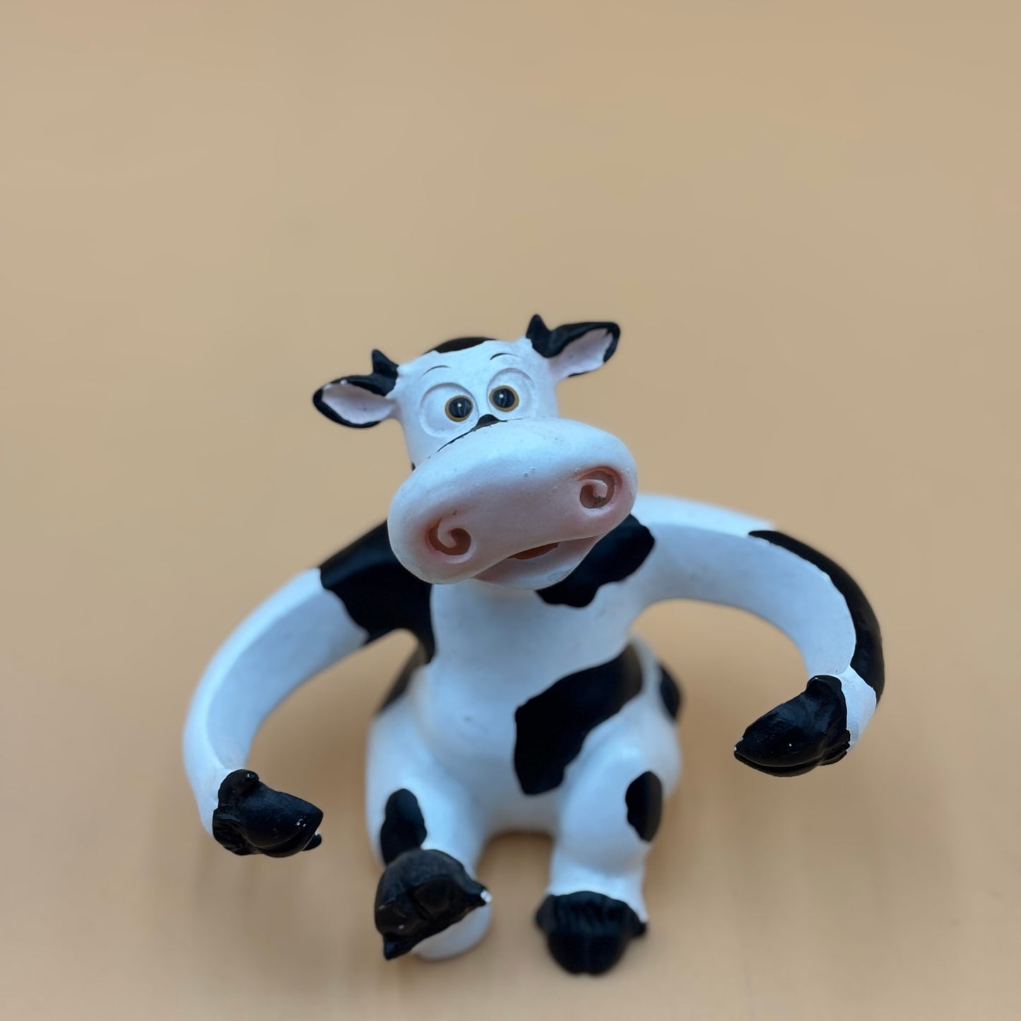 Stretch-Arm Cow Figurine – L Dake & Ln Vintage Stone Like