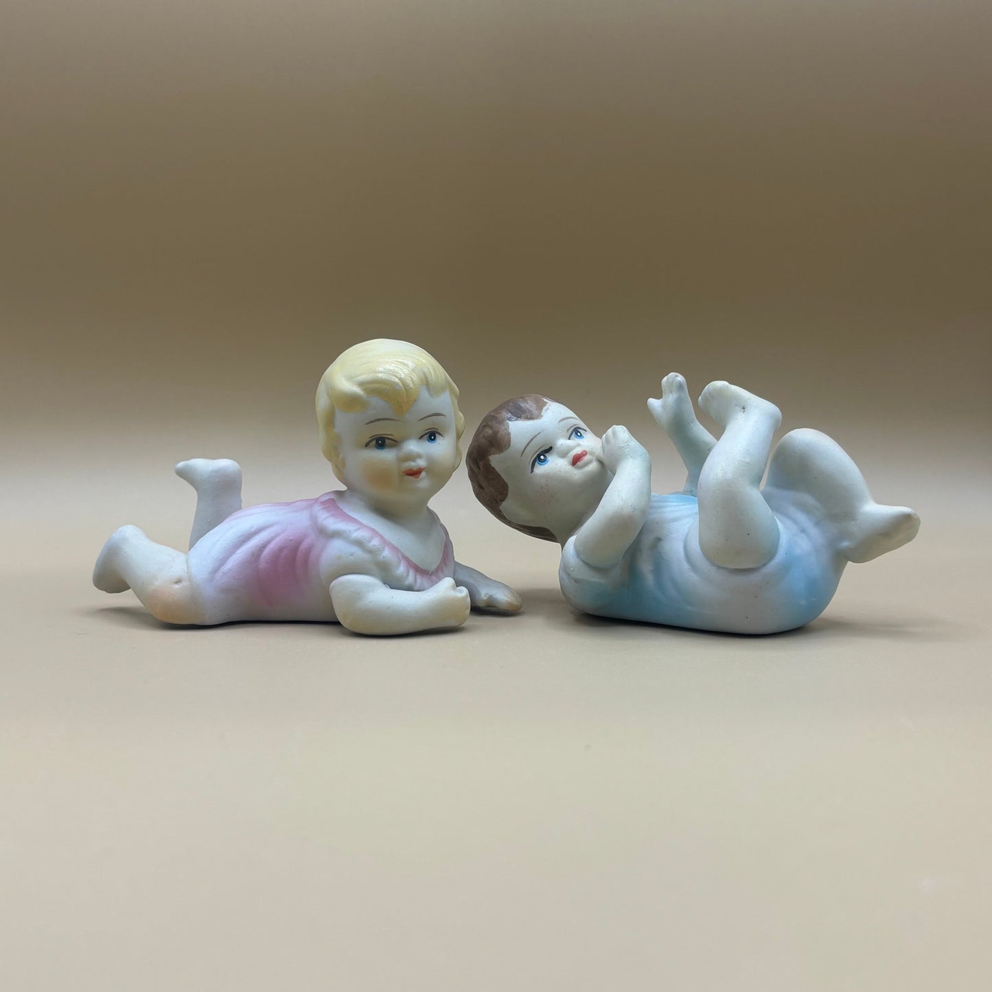 Pair of Porcelain Vintage Playing Baby Figurines