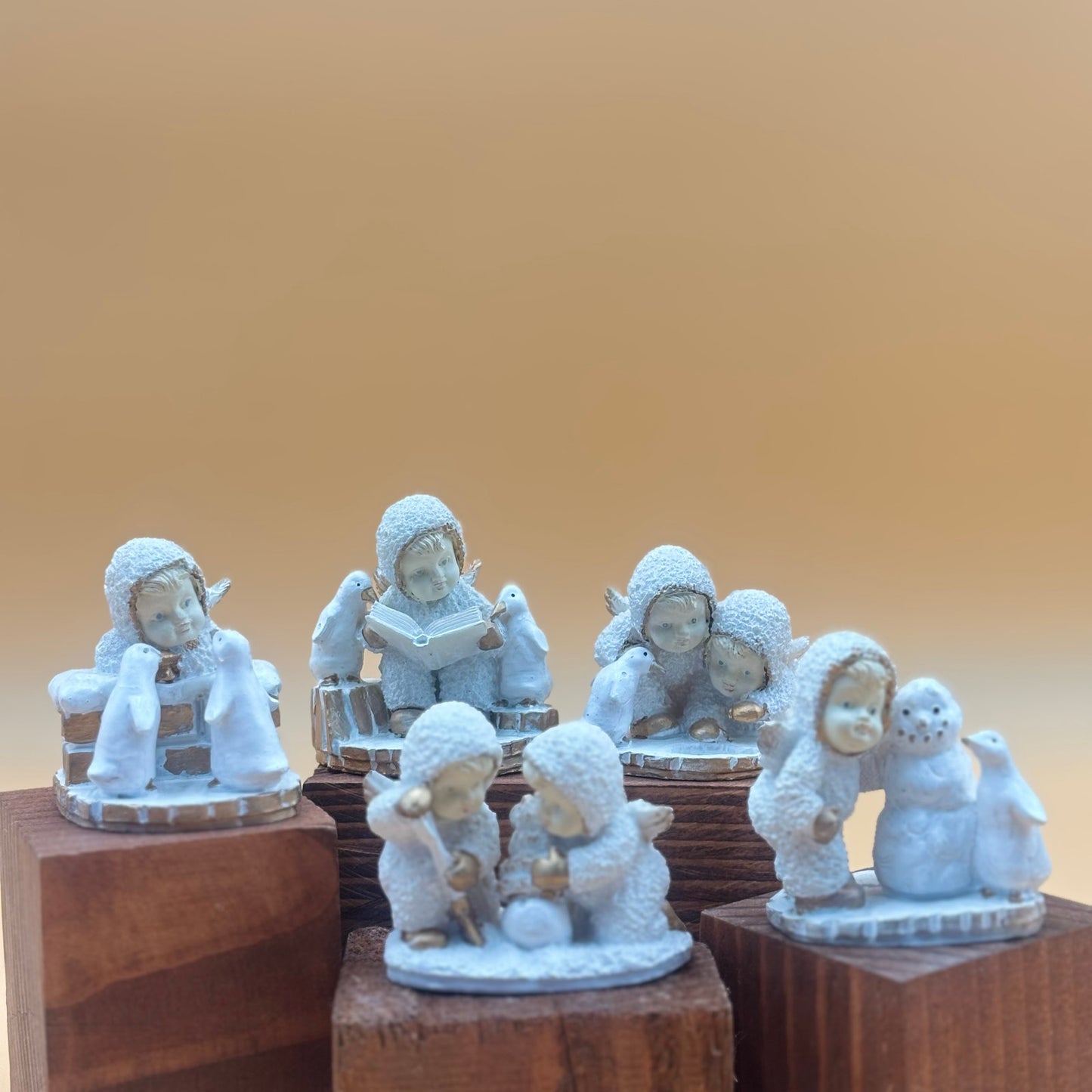 Textured Vintage resin 5 piece winter wonderland figurine with snow men and penguins