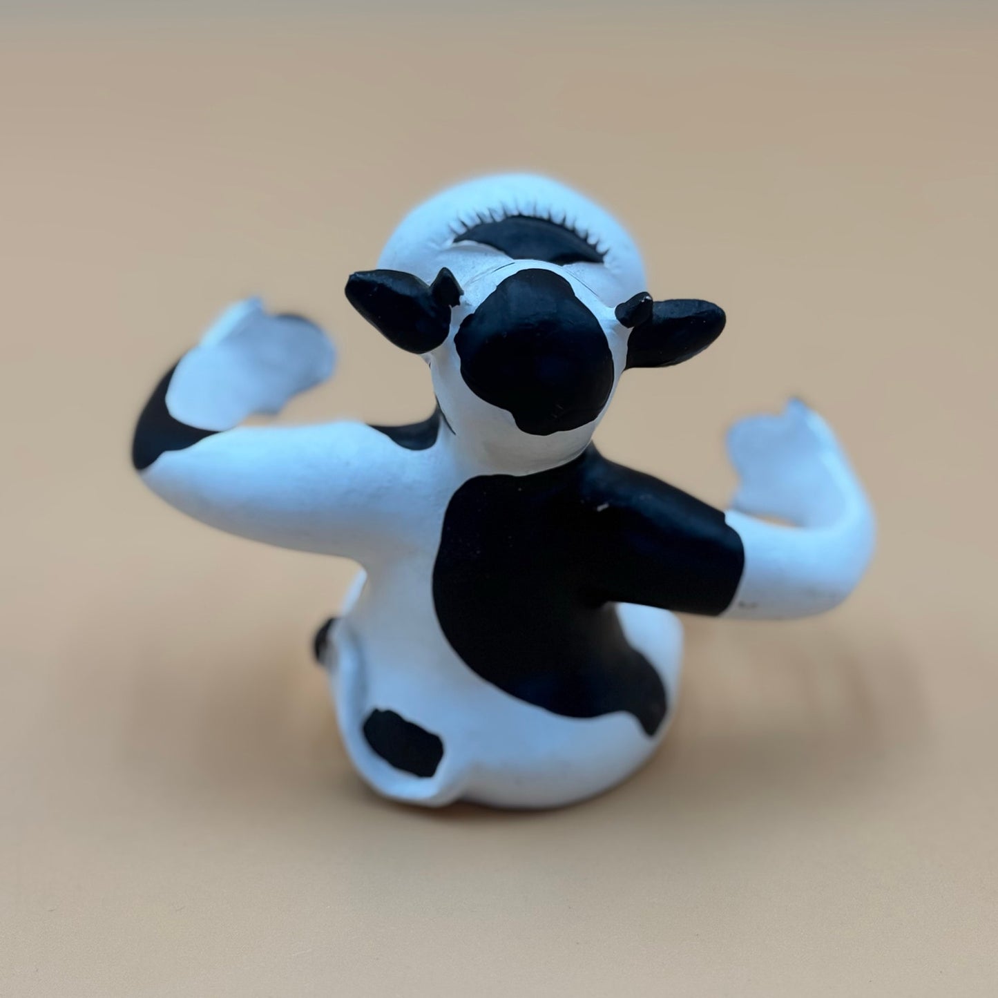 Stretch-Arm Cow Figurine – L Dake & Ln Vintage Stone Like