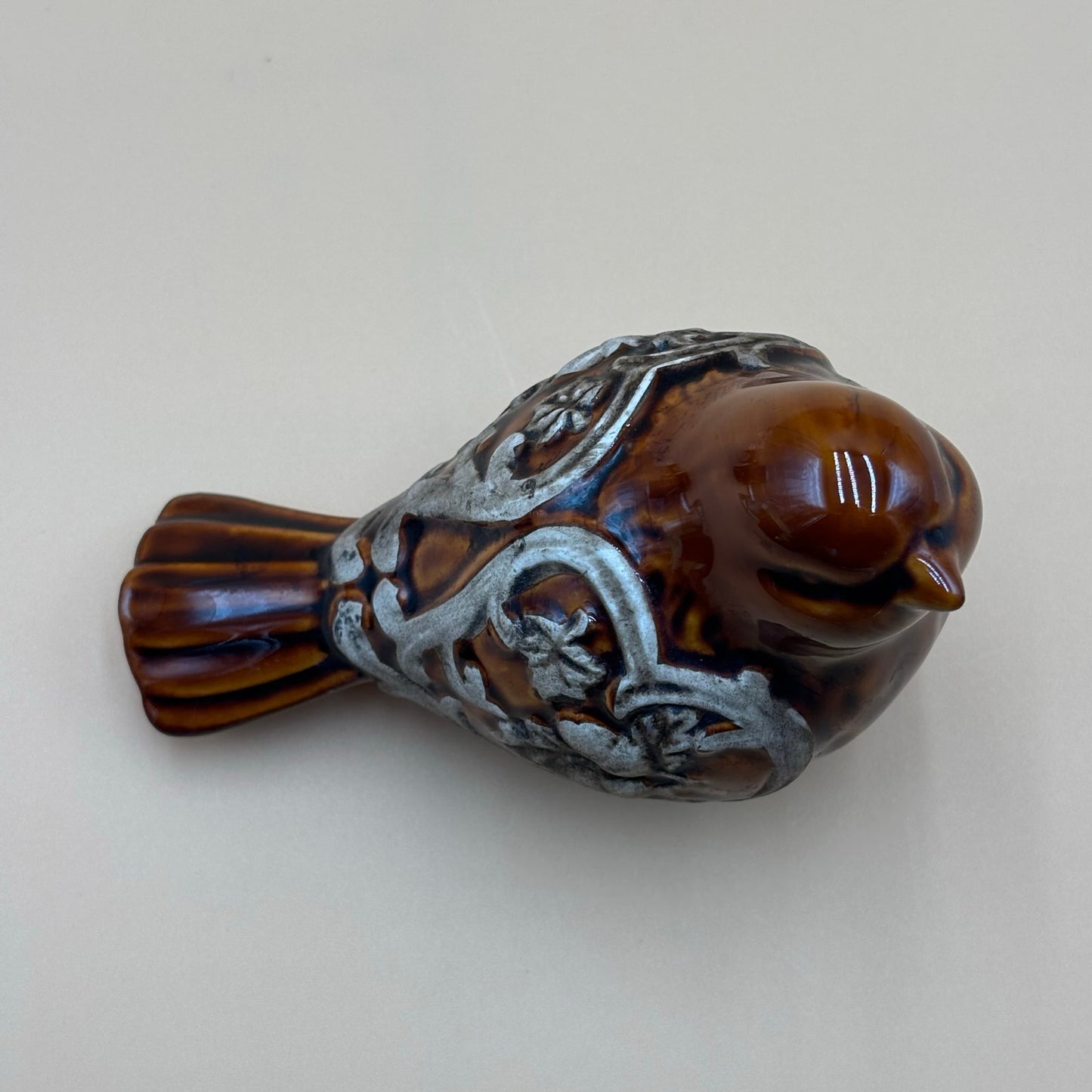 Brown Glazed Ceramic Bird Figurine with Raised Leaf and Vine Detail