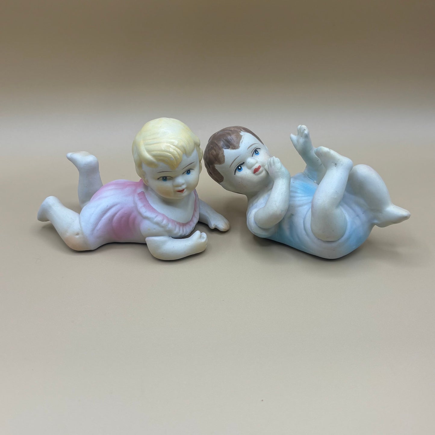 Pair of Porcelain Vintage Playing Baby Figurines