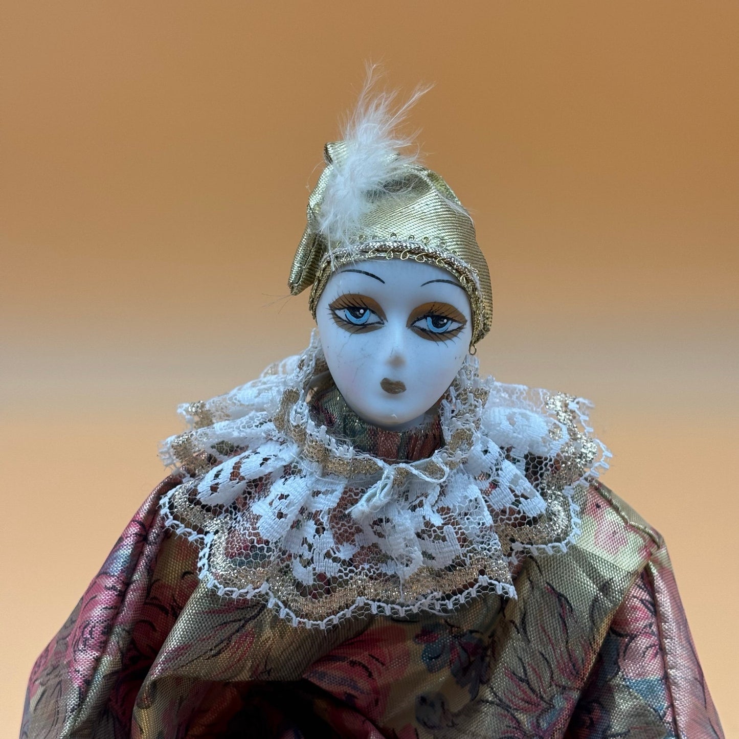 Porcelain Musical Clown Doll – Gold & Floral Dres