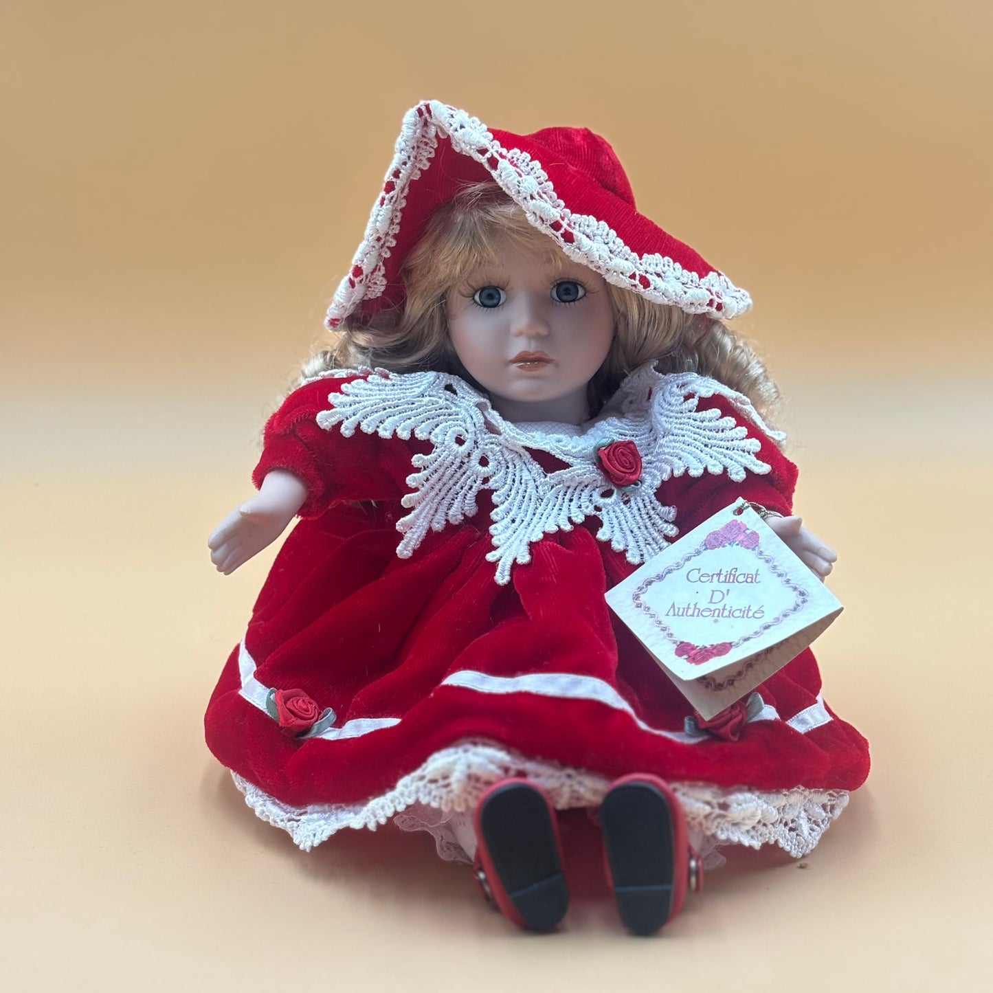 Collector’s Choice Musical Porcelain Doll in Red Velvet Dress with Bonnet