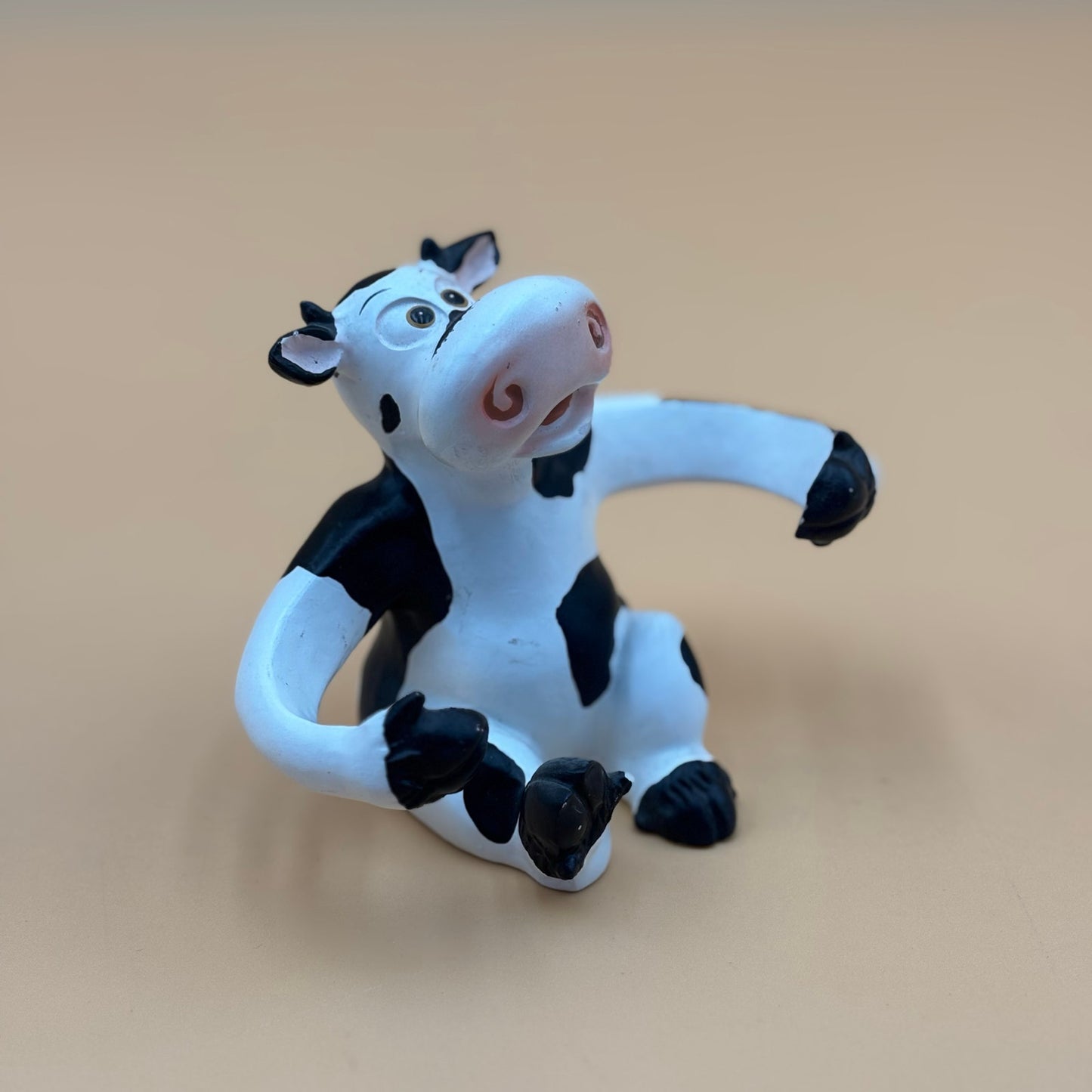 Stretch-Arm Cow Figurine – L Dake & Ln Vintage Stone Like