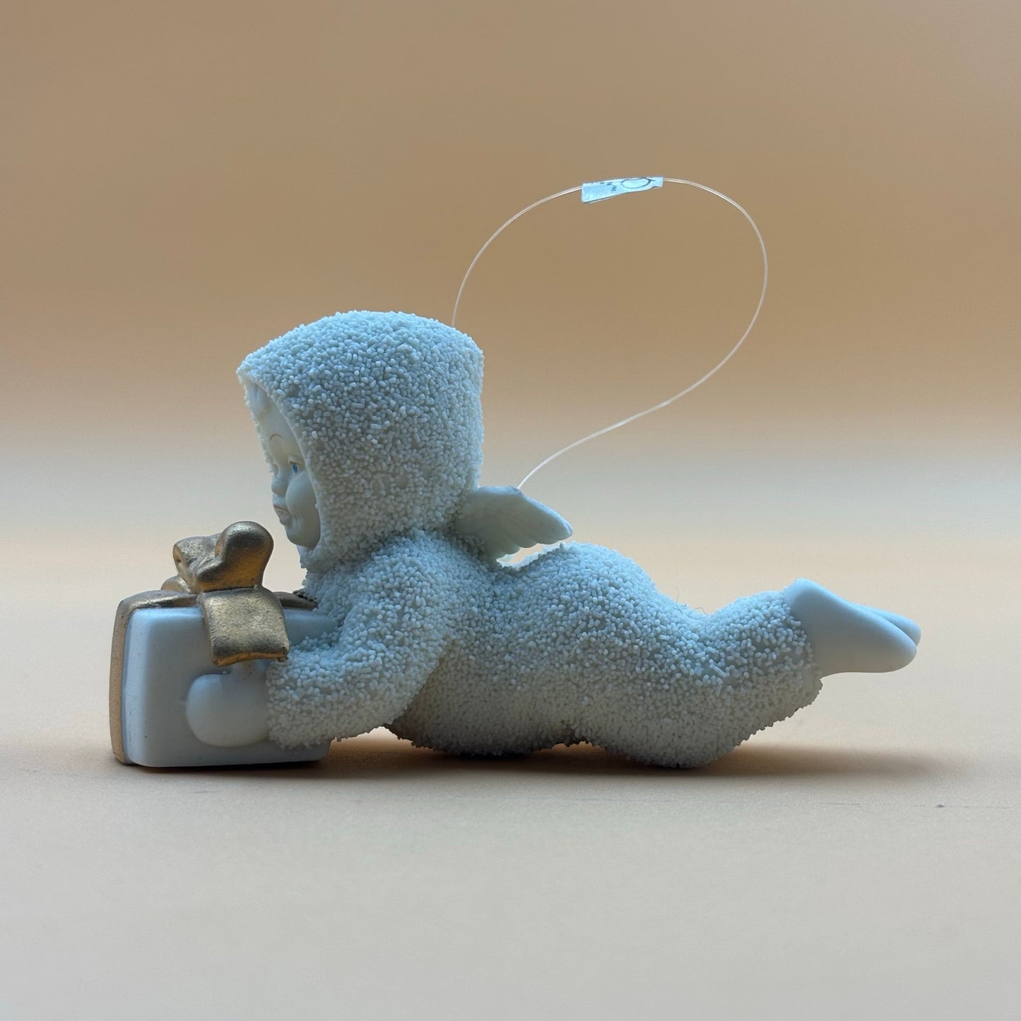 Department 56 Snowbabies “Gift Bearer” Ornament – Laying with Present