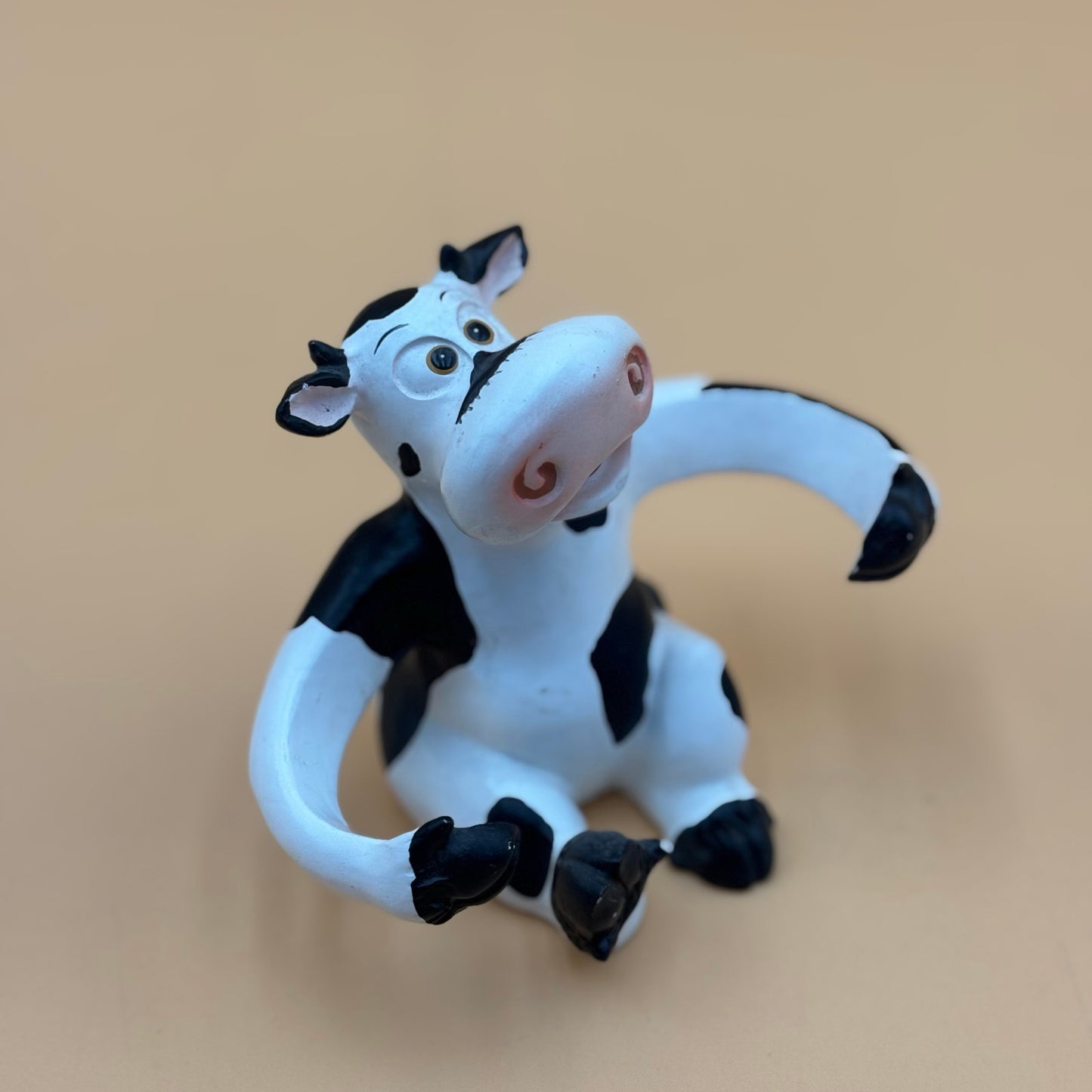 Stretch-Arm Cow Figurine – L Dake & Ln Vintage Stone Like