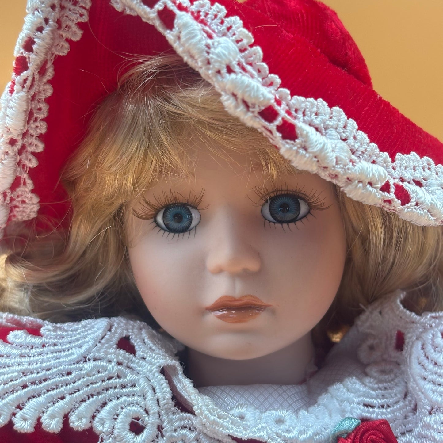 Collector’s Choice Musical Porcelain Doll in Red Velvet Dress with Bonnet