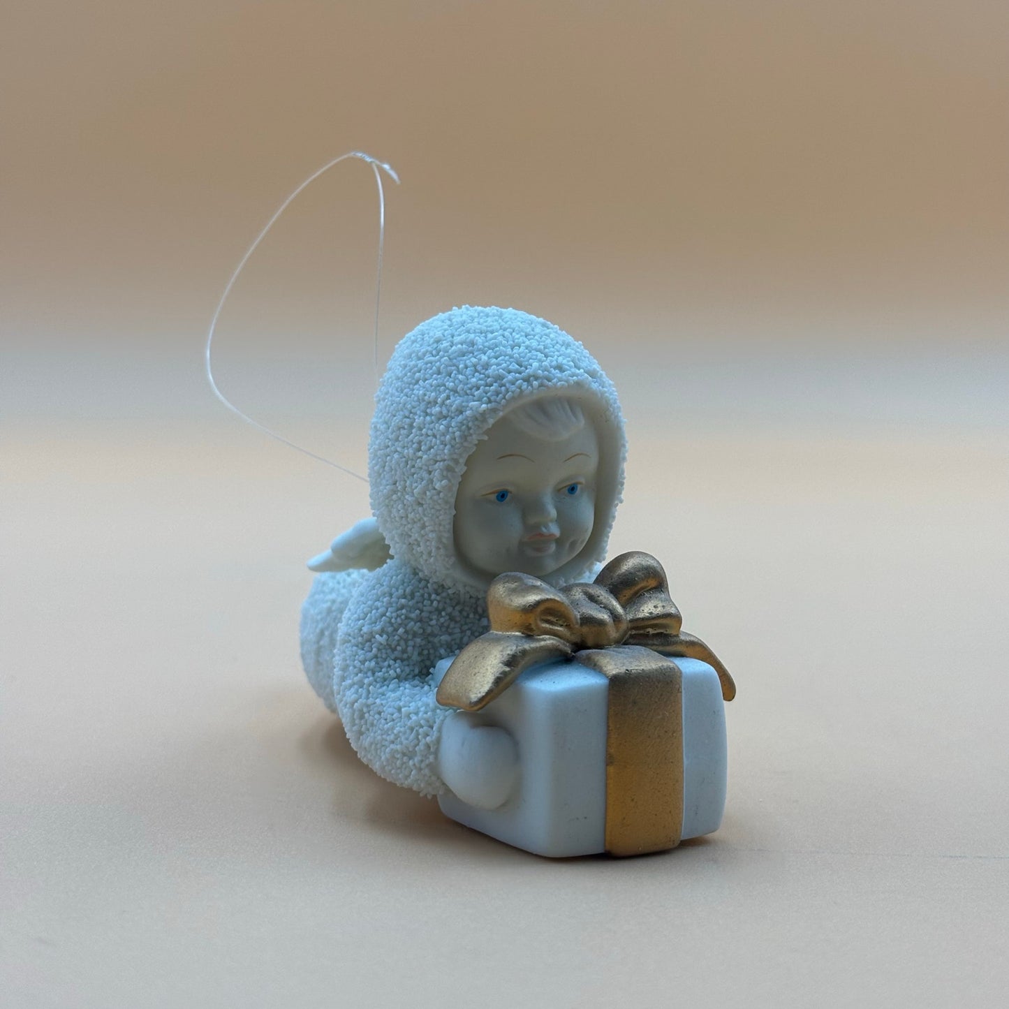 Department 56 Snowbabies “Gift Bearer” Ornament – Laying with Present