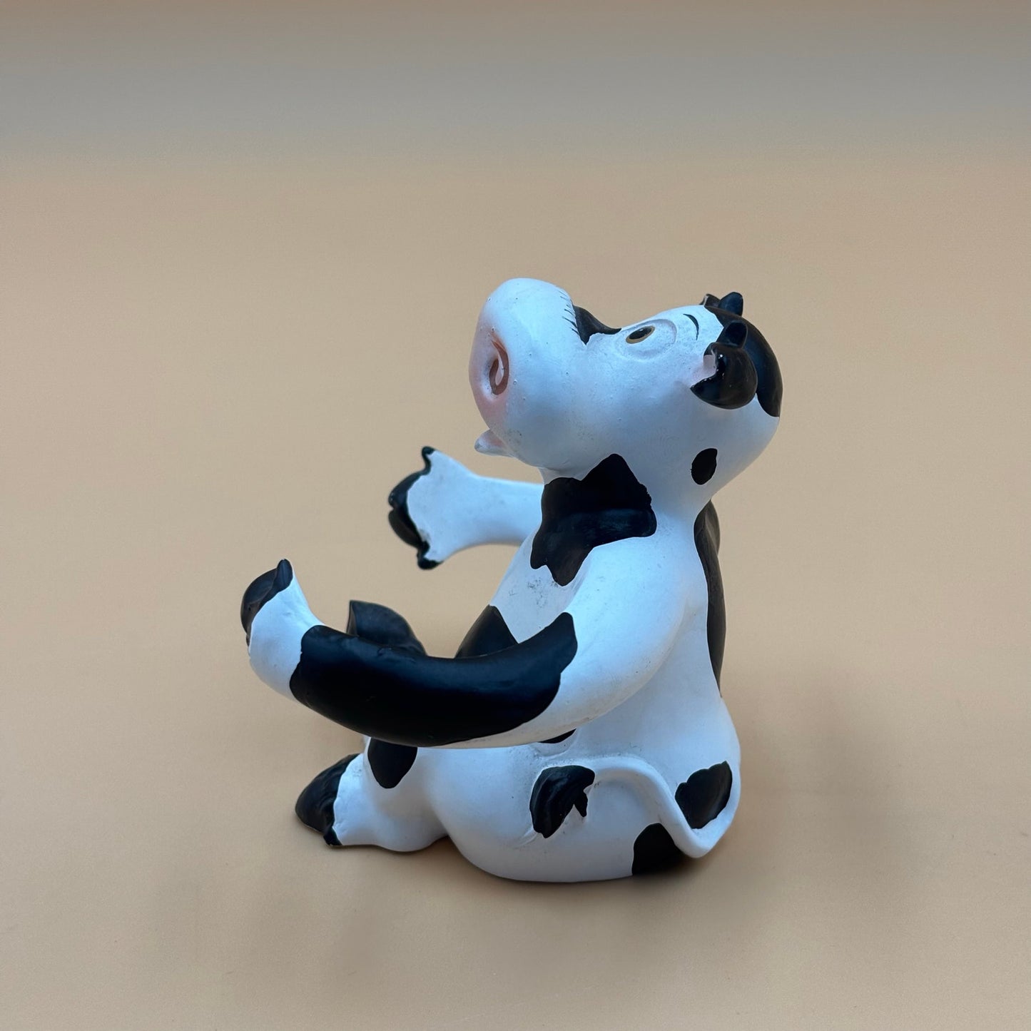 Stretch-Arm Cow Figurine – L Dake & Ln Vintage Stone Like