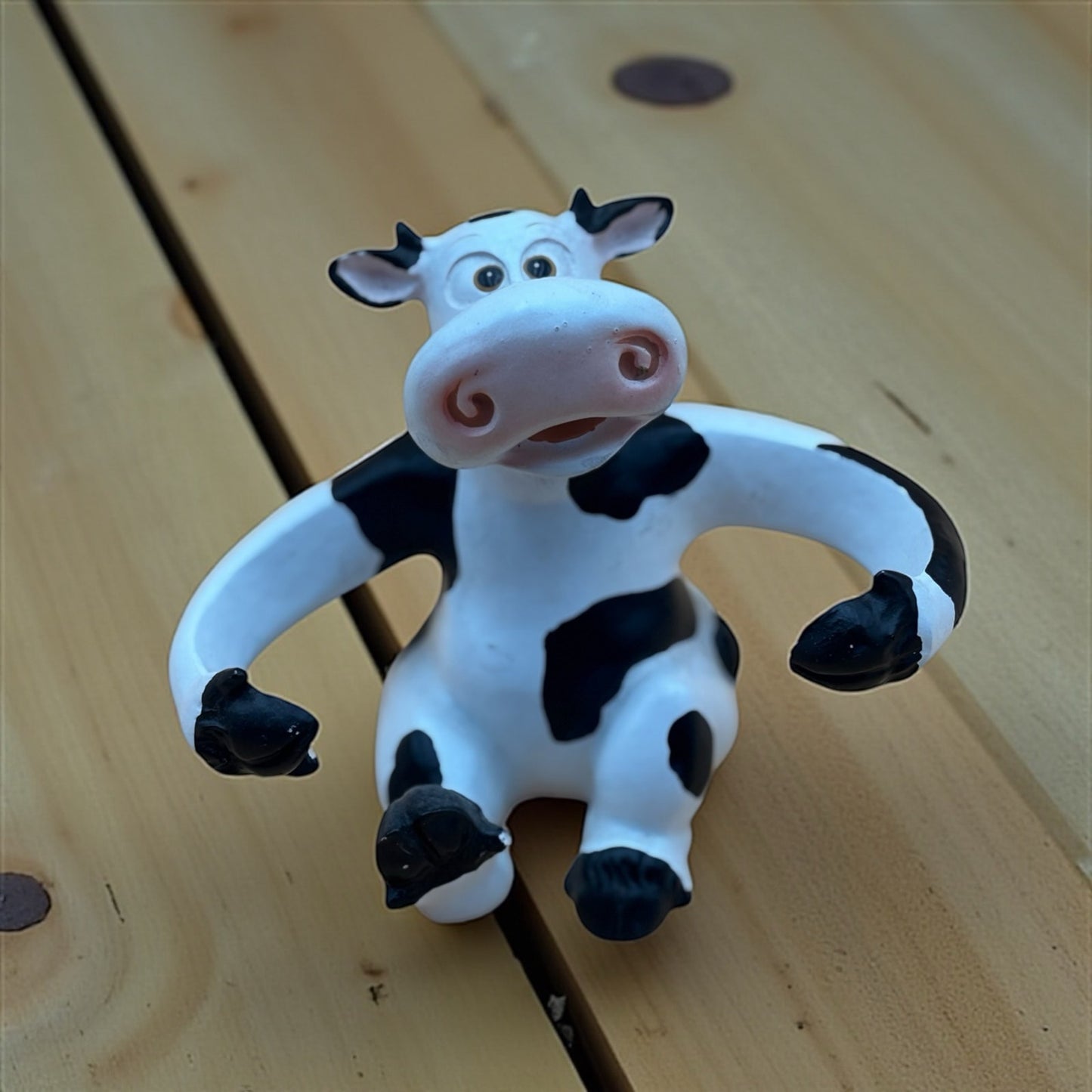 Stretch-Arm Cow Figurine – L Dake & Ln Vintage Stone Like