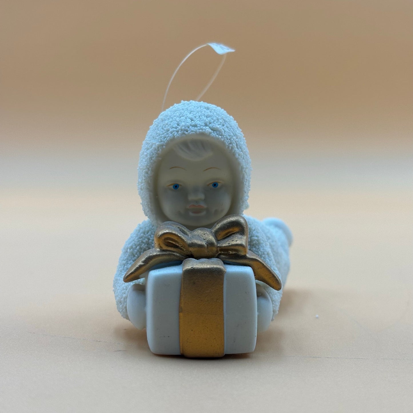 Department 56 Snowbabies “Gift Bearer” Ornament – Laying with Present