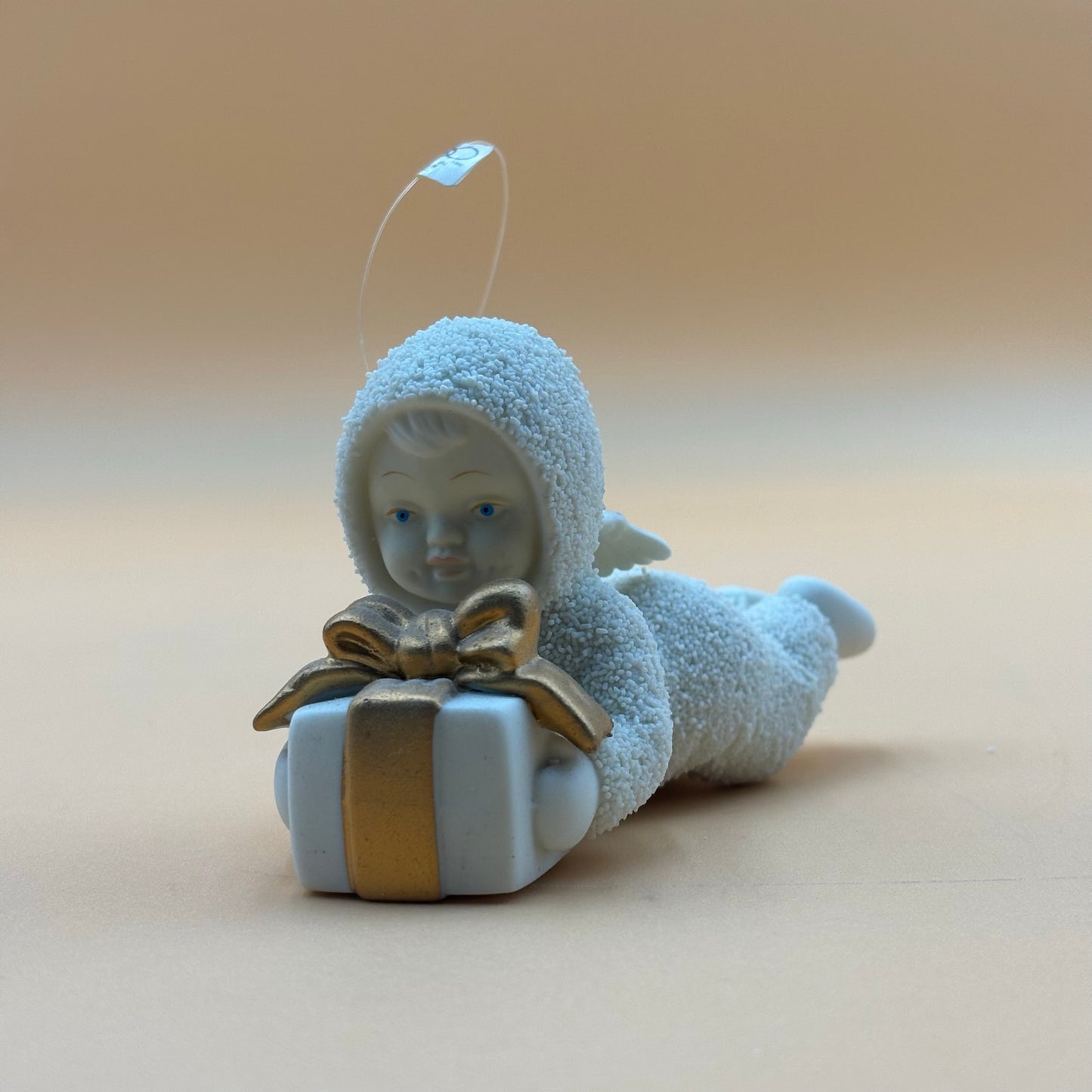 Department 56 Snowbabies “Gift Bearer” Ornament – Laying with Present