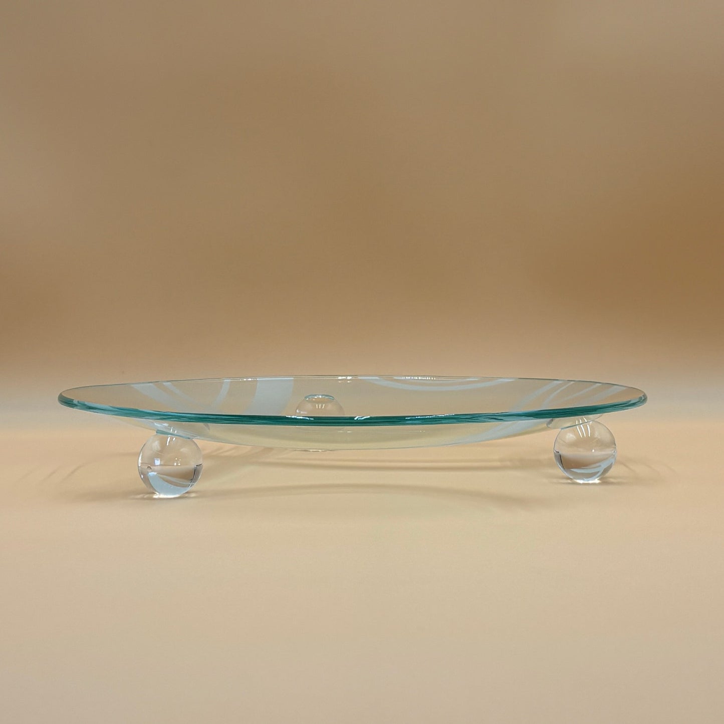 Retro Clear Glass Serving Platter with Modern Abstract Design and Ball Feet