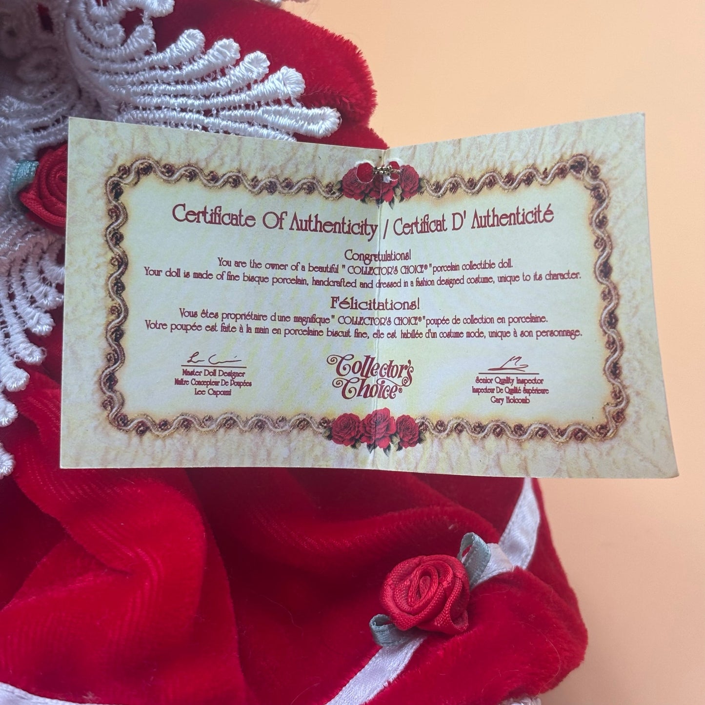 Collector’s Choice Musical Porcelain Doll in Red Velvet Dress with Bonnet