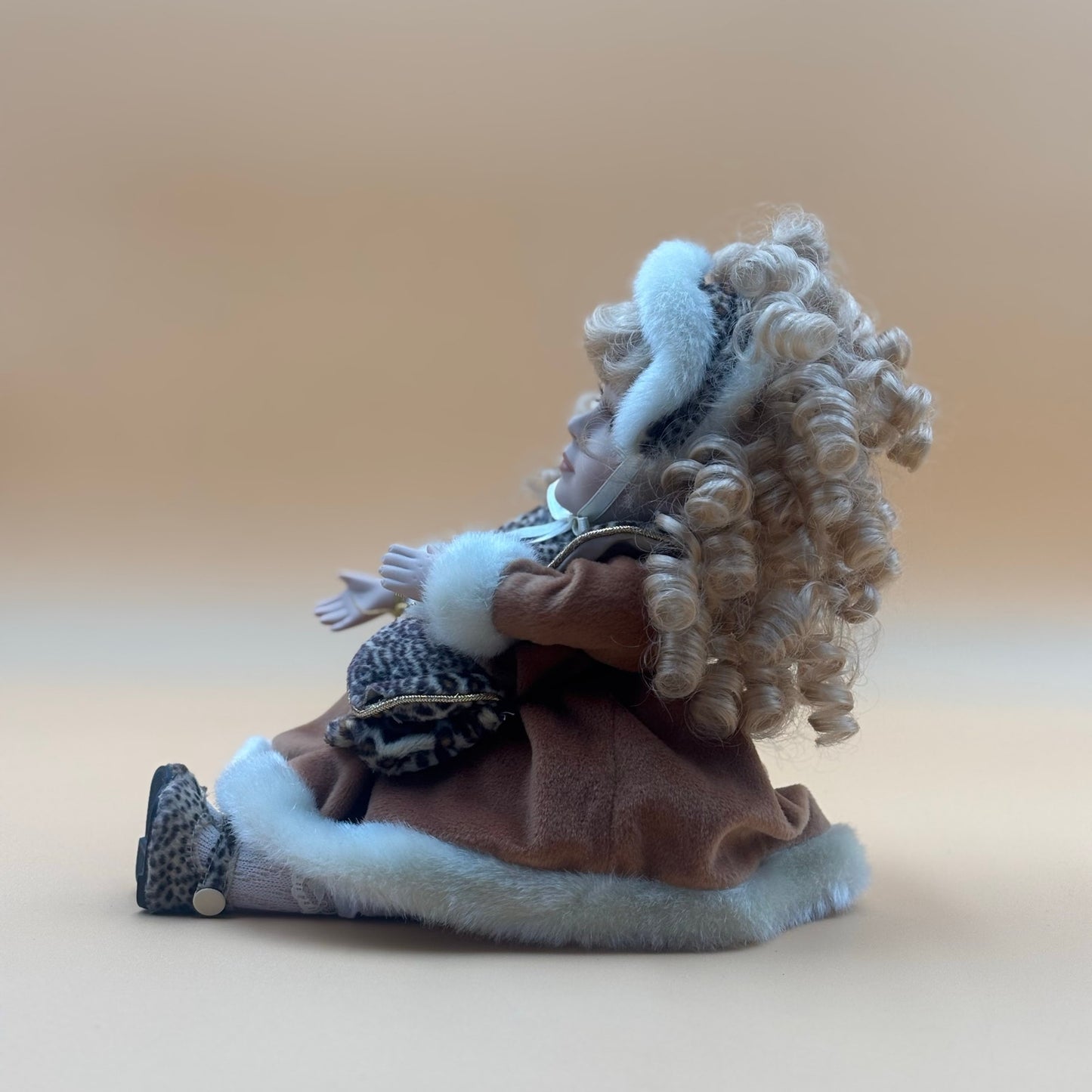 Collector’s Choice Animated Musical Porcelain Doll with Faux Fur & Leopard Trim Coat